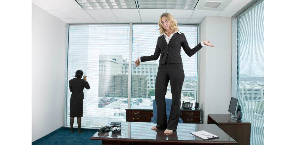 woman-standing-on-top-of-a-desk